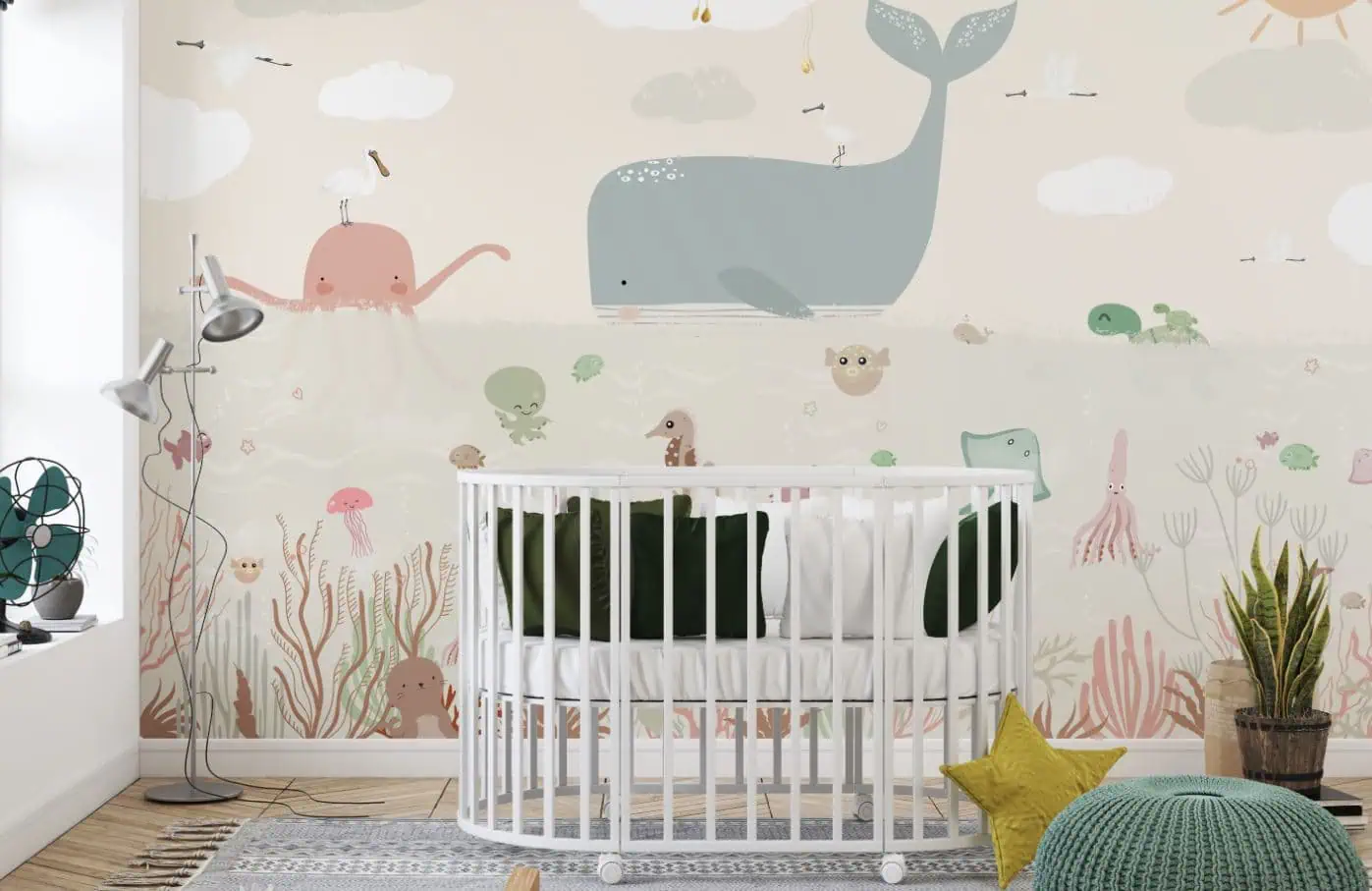 babykamer behang walvis achter wiegje in babykamer