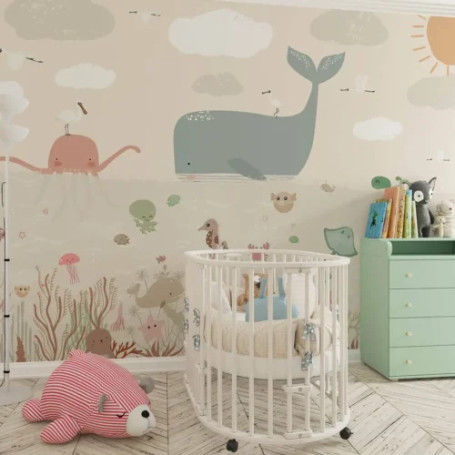 babykamer behang walvis achter wieg en commode in babykamer