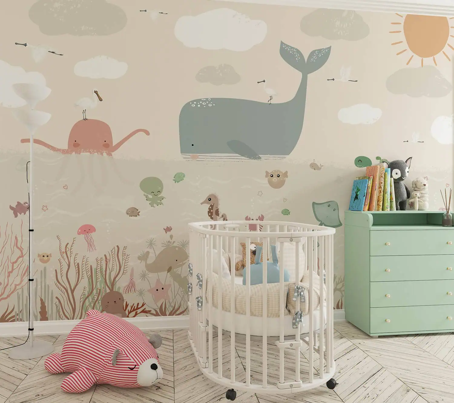 babykamer behang walvis achter wieg en commode in babykamer