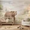 babykamer behang beer in pastel bos achter wiegje in babykamer