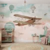 kinderkamer behang vintage vliegtuig pastel achter houten ledikant in kinderkamer